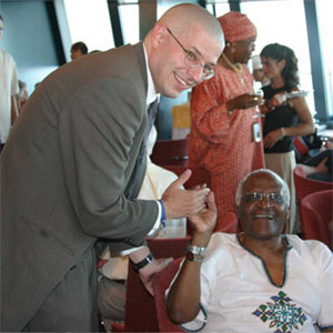 Jason high 5-ing Desmond Tutu