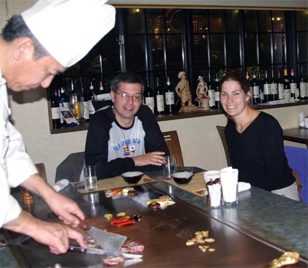 Jason and Amy and the chef preparing our Kobe Beef meal